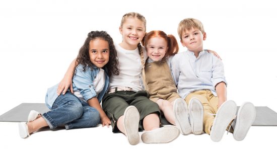 happy-multiethnic-children-sitting-together-isolated-on-white.jpg